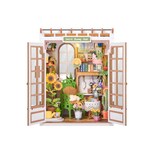 Miniature garden-themed room with open doors on a white background