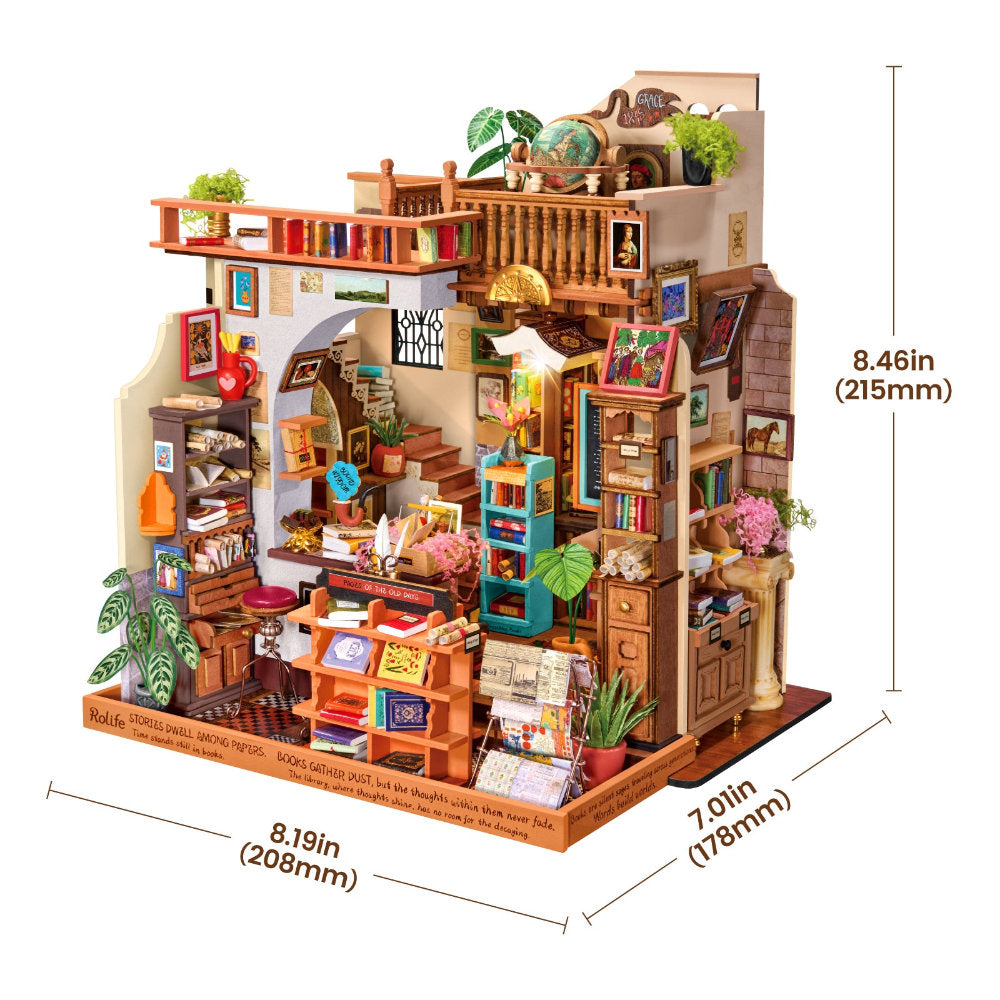 A miniature wooden house model with detailed interior rooms, shelves, plants, books, and decorative elements, shown with dimension labels indicating 8.46 in height, 8.