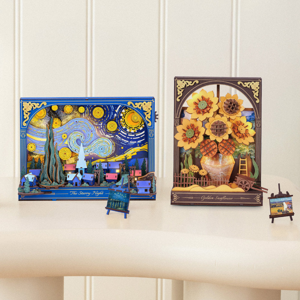 Two decorative boxes with artistic designs on a white surface.