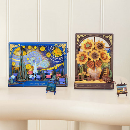 Two decorative boxes with artistic designs on a white surface.