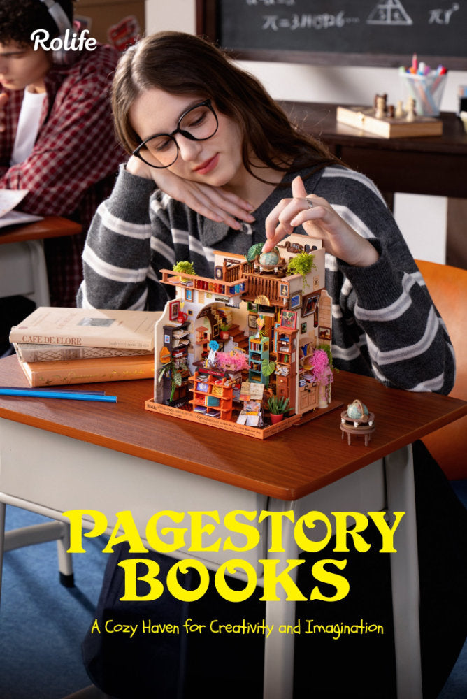 A woman in a classroom setting looks down at a small wooden multi-level house model with tiny decorative details. The scene includes books on the desk, a chalkboard in the background, and large yellow text reading 'PAGESTORY BOOKS' with the Rolife brand at the top left.