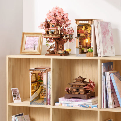 Wooden shelves with decorative models, books, and a framed picture on a light background
