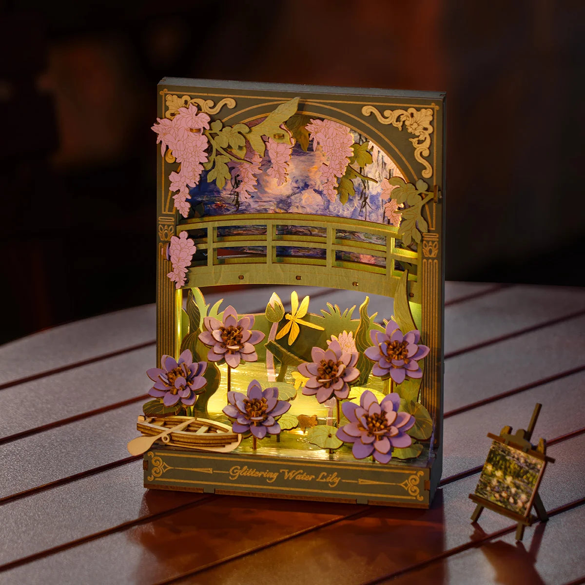 Decorative lamp with water lily design on a wooden surface