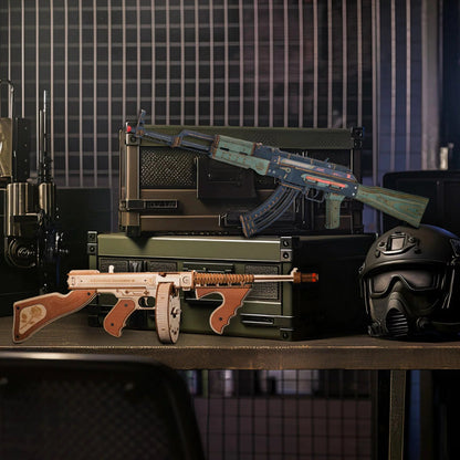 Decorative prop guns and helmet on a table with a grid-patterned wall in the background
