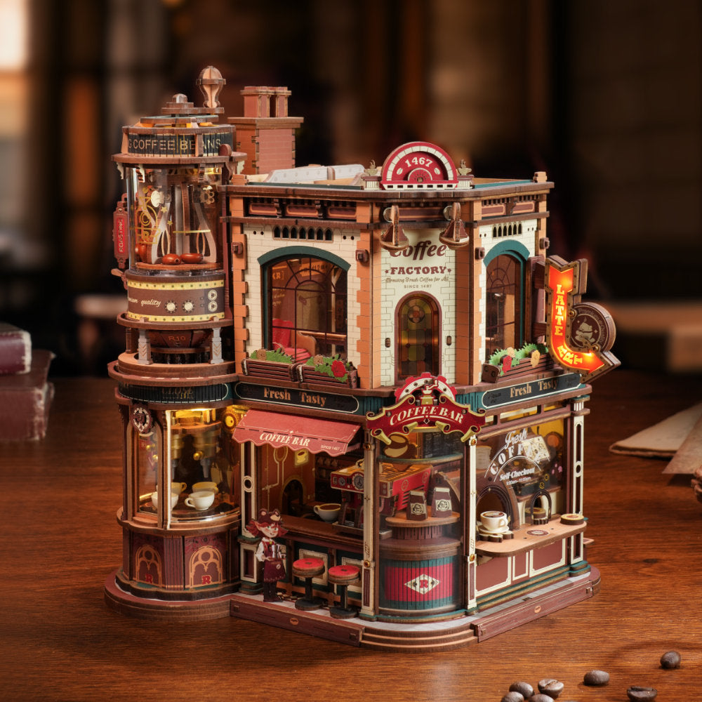 Detailed model of a coffee factory on a wooden surface with a blurred background