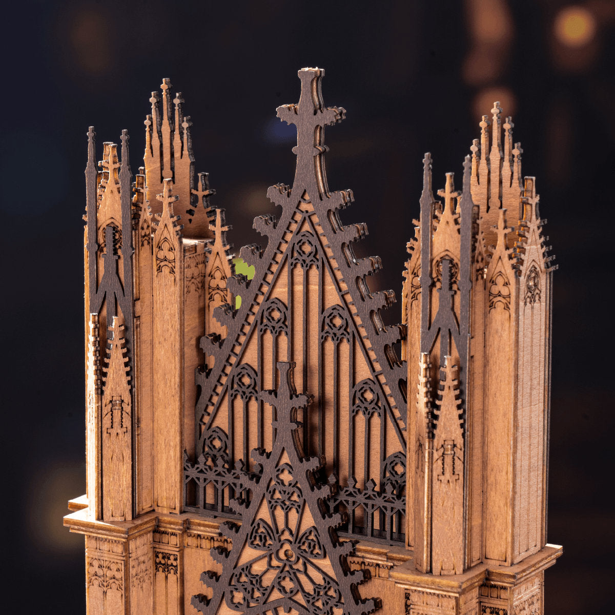 Gothic architectural model with intricate details on a dark background