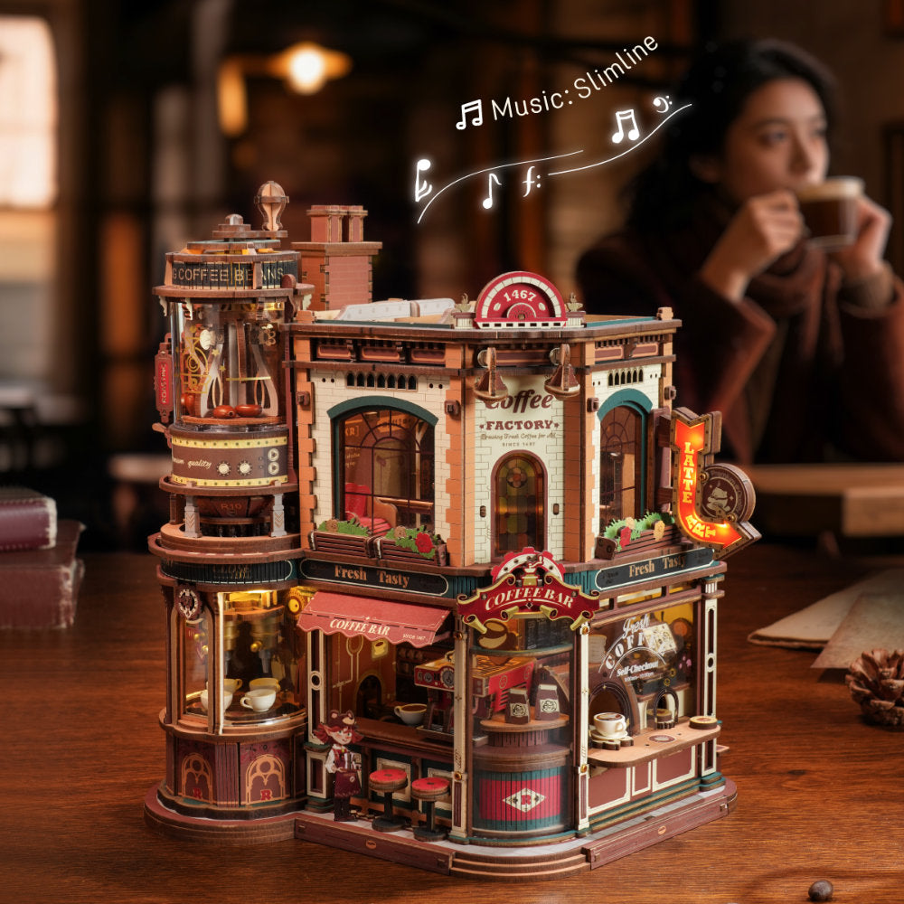 Detailed model of a coffee factory on a table with blurred background