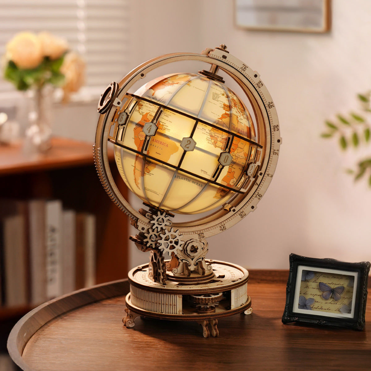 Decorative globe with mechanical design on a wooden surface