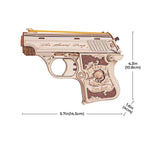 Wooden gun model with intricate details and measurements on a white background