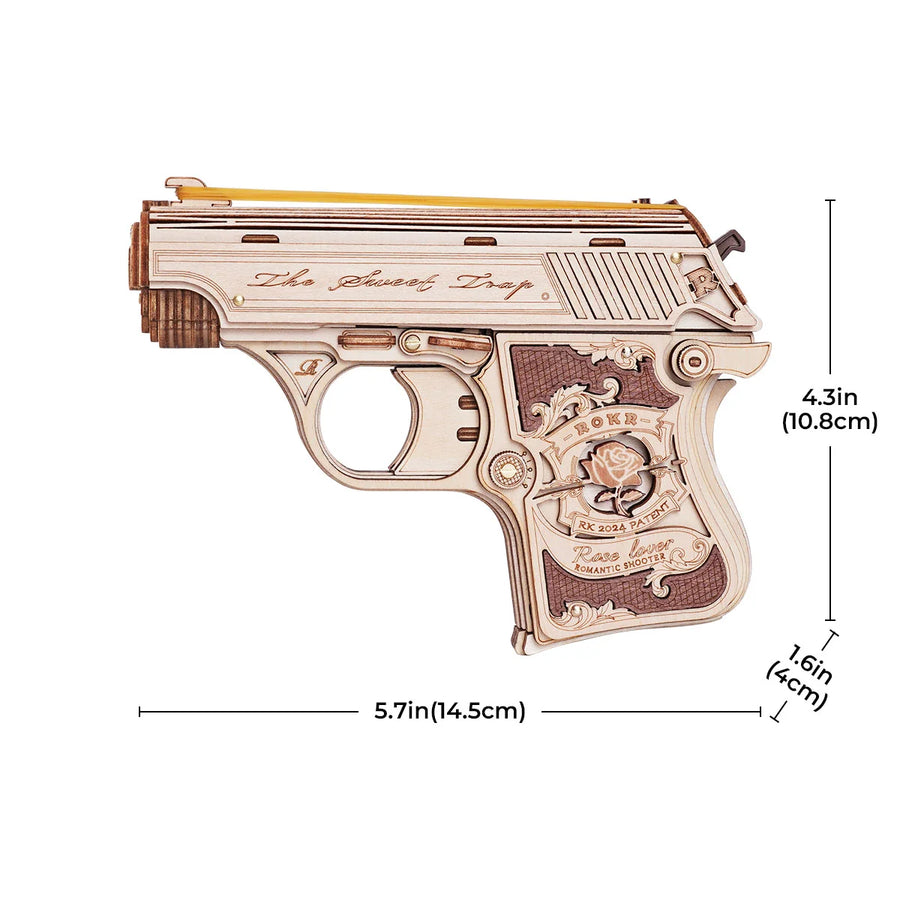 Wooden gun model with intricate details and measurements on a white background