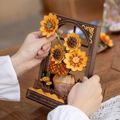 Handmade sunflower decoration held by a person with a blurred background