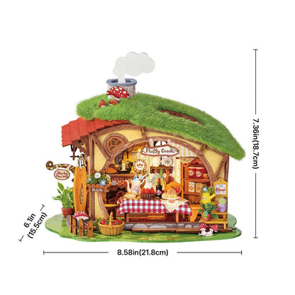 Miniature model of a quaint inn with dimensions displayed