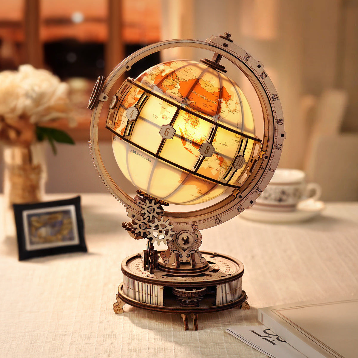 Decorative globe with stained glass design on a table