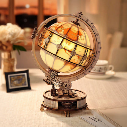 Decorative globe with stained glass design on a table
