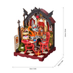 A miniature gothic fantasy tea party diorama with a cat in a red chair, shown with dimension lines indicating 13.5cm height, 10cm width, and 9cm depth on a white background.