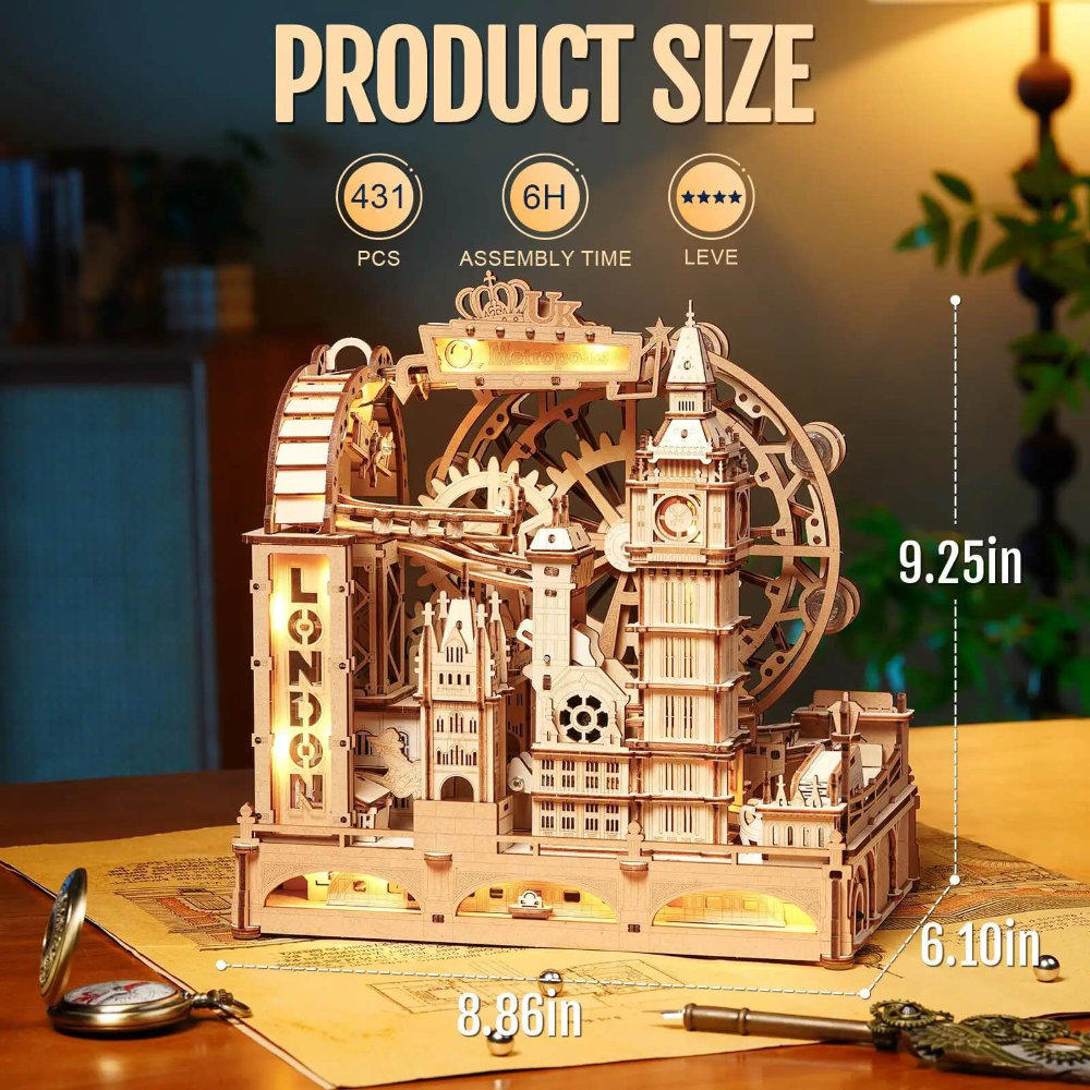 Wooden mechanical model of a London-themed building with size measurements on a table.