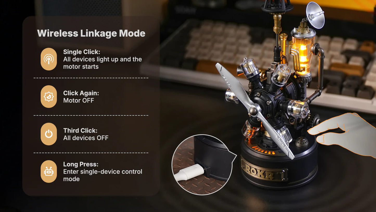 Mechanical model with control panel and keyboard in the background