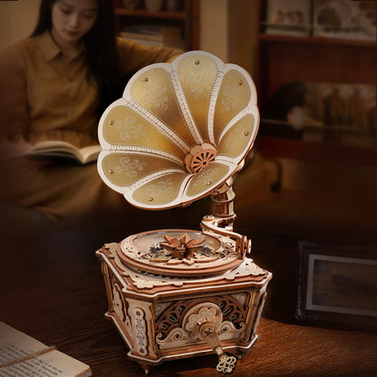 Vintage-style music box on a wooden surface with a blurred background