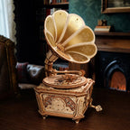Vintage-style gramophone on a wooden surface with a blurred background