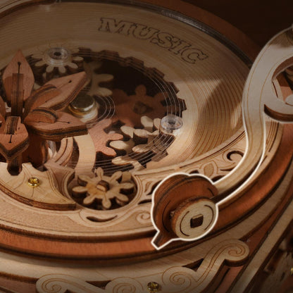 Close-up of a wooden music box mechanism with intricate details.