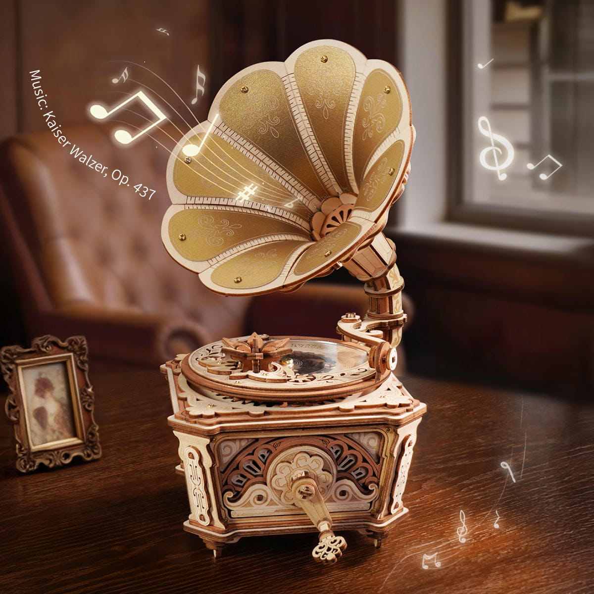 Vintage-style music box with decorative shell design on a wooden surface.