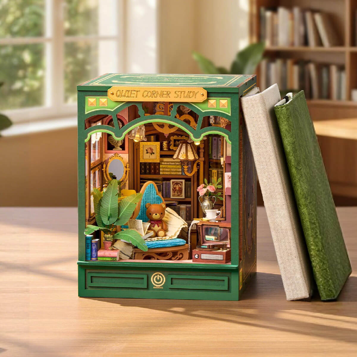 Wooden model of a room with books on a table