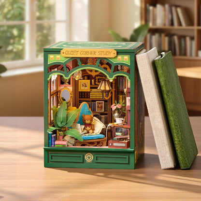 Wooden model of a room with books on a table