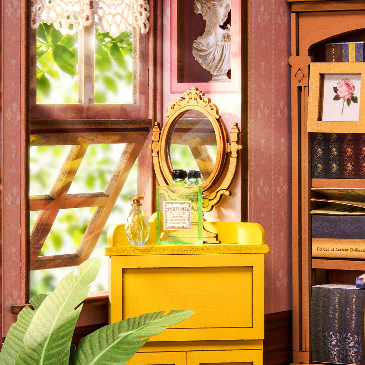 Yellow vanity table with a mirror, bottles, and books in a decorative room.