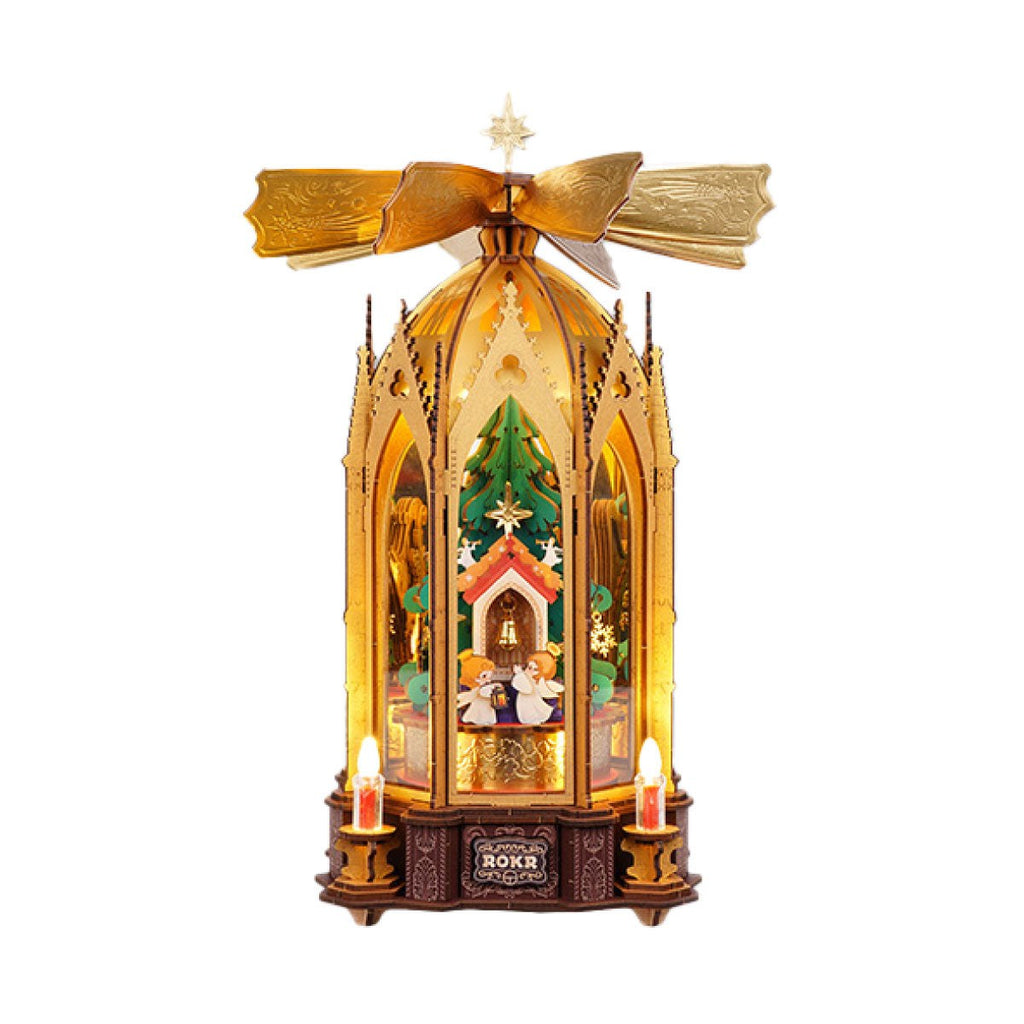 Wooden-Town Angel's Christmas Pyramid 3D wooden puzzle music box – finished golden pyramid with angel scene and lit candles on a white background