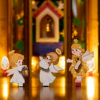 Wooden-Town Angel's Christmas Pyramid 3D wooden puzzle music box – close-up of three angel figures with a lantern in front of the chapel scene