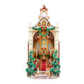Wooden-Town Caroling Cathedral 3D wooden book nook kit – finished cathedral with snow-dusted roof, wreath, twin decorated trees and lit interior on a white background