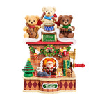 Wooden-Town Fireside Music Night 3D wooden puzzle music box – finished model with three teddy bears on a brick fireplace and red crank on a white background