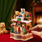 Wooden-Town Fireside Music Night 3D wooden puzzle music box – hand turning the red crank beside a plush teddy bear