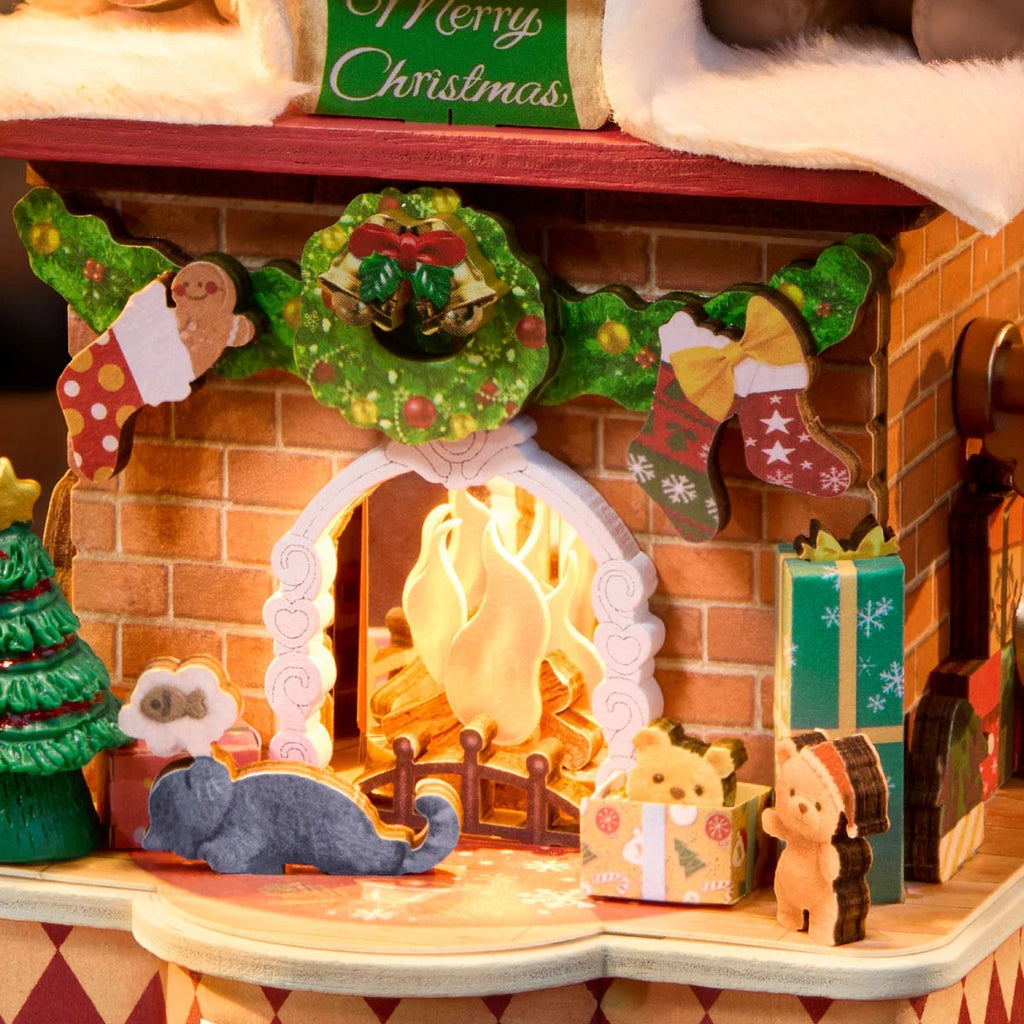 Wooden-Town Fireside Music Night 3D wooden puzzle music box – close-up of the glowing hearth with wreath, stockings and a grey cat