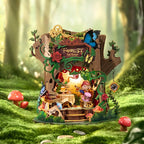 Wooden-Town Forest Tea Party Music Box Kit – glowing on a mossy forest floor