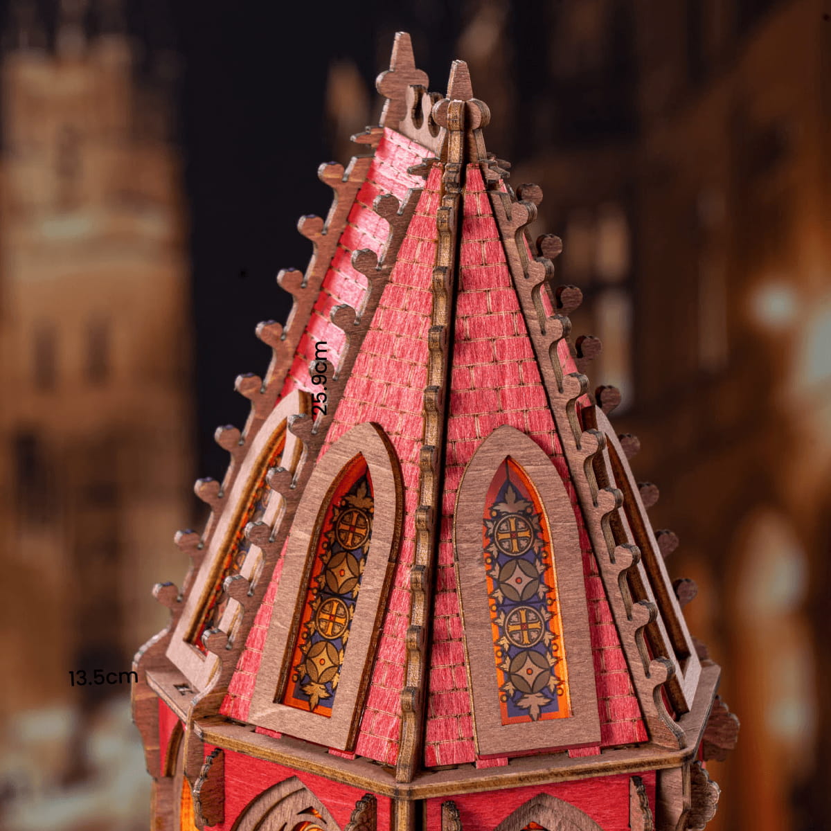 Detailed model of a red and brown architectural structure with intricate designs.