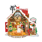 Wooden-Town Polaris Post DIY miniature house kit – finished Christmas post office with red roof, Santa at his desk, tree and red mailbox on a white background