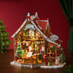 Wooden-Town Polaris Post DIY miniature house kit – post office glowing warmly against a red backdrop with a green tree