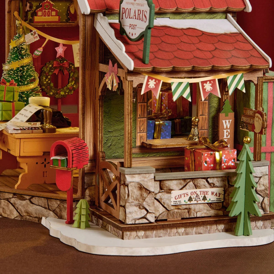 Wooden-Town Polaris Post DIY miniature house kit – porch with red mailbox, Polaris Post sign, stone-look base and Gifts on the Way sign