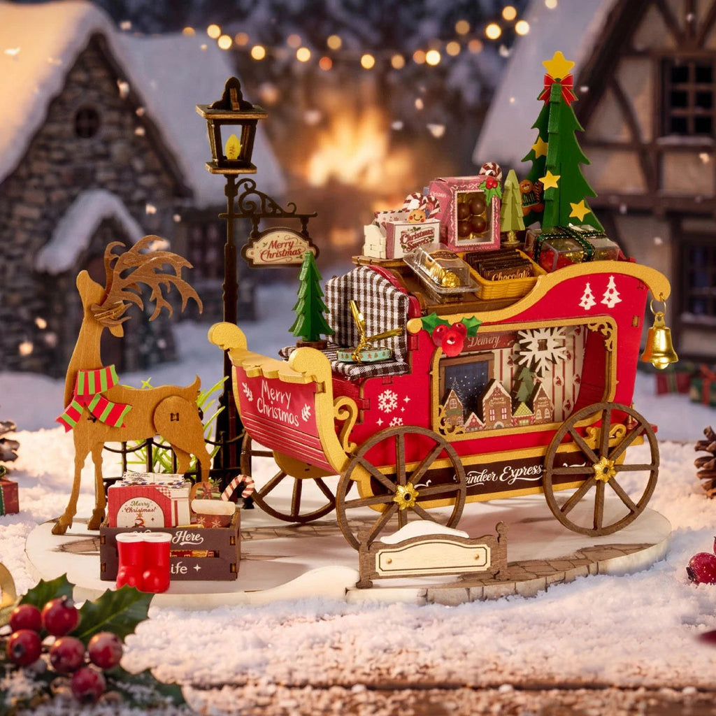 Wooden-Town Reindeer Express DIY miniature kit – sleigh and reindeer in a snowy village scene with warm lights